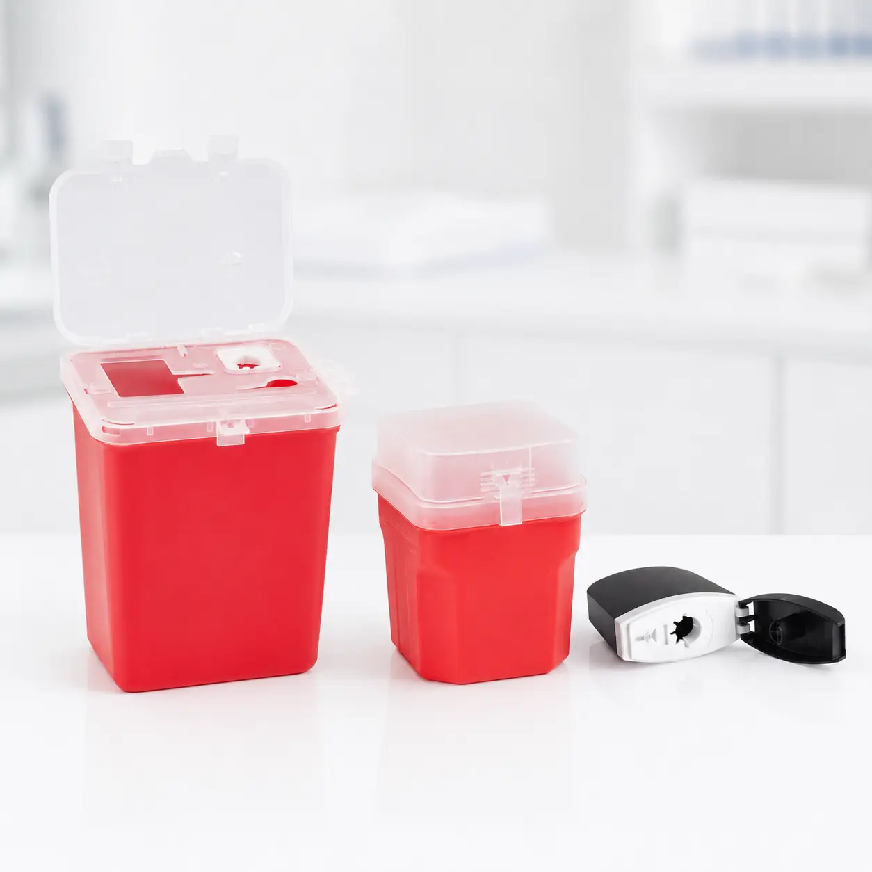 Sharps containers and portable disposal cases shown in multiple capacity formats