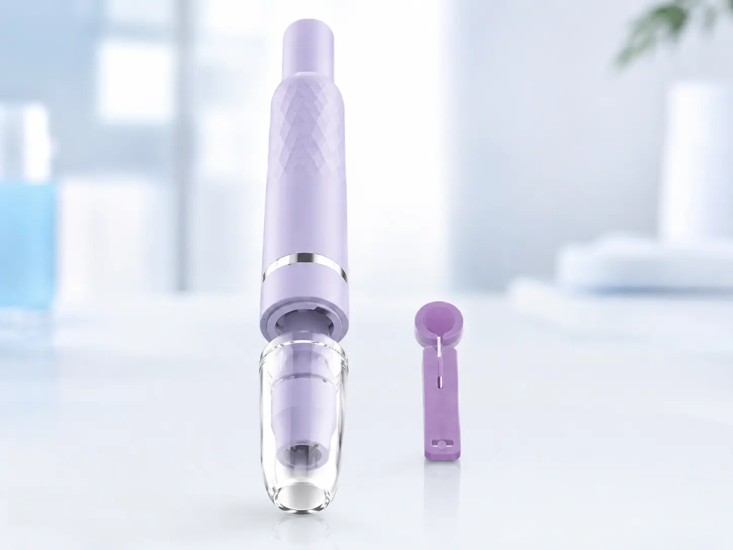 Reusable lancing device displayed with a compatible blood lancet